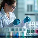Scientist at cosmetics research lab bench